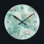 Horloge Ronde Corail et coques sous-marins en Aquarelle Turquois<br><div class="desc">Transformez votre espace en une escapade balnéaire sereine grâce à cette superbe horloge ronde avec un design de corail sous-marin et de coquillages. Peint dans des tons turquoises apaisants avec des textures d'aquarelle, le design saisit la magie tranquille du plancher océanique. Les branches de corail mou et les coquillages délicats...</div>