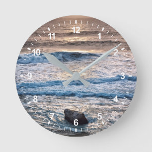 Horloge Ronde Coucher de soleil délicat sur la plage