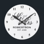 Horloge Ronde Custom M. et Mme Newlyweds Wedding vend clock<br><div class="desc">Custom M. et Mme Newlyweds est un poison. Elegant script typographiy template with family name and date of marriage. Classy presents for just married couple or bride and groom. Chic black and white design home decor. Personalized decor for unique kitchen, office, living room, menacé, etc. Add your own established year...</div>