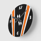 Horloge Ronde Design Art Déco Noir Et Orange Monogramme (Angle)