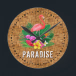 Horloge Ronde Flamant rose Floral Paradise<br><div class="desc">Un flamant rose,  des fleurs tropicales et des feuilles sur motif tissé en osier et le mot PARADISE fait une horloge murale élégante à thème d'été. CORRESPONDRE des articles dans notre magasin.</div>
