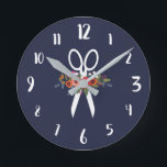 Horloge Ronde Floral Scissors<br><div class="desc">Round wall clock for a hair salon. Navy blue wall clock featuring a pair of white scissors decorated with flowers L'arrangement floral comprises flowers en rouge,  orange,  rose et blanc. With white calligraphy numbers.</div>