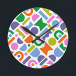 Horloge Ronde Formes géométriques colorées<br><div class="desc">Un design coloré et moderne, aux formes géométriques découpées. Ce design ludique s’inspire d’un style moderne rétro du milieu du siècle et serait parfait pour la maison moderne, la salle de récréation, la salle de jeux ou la chambre pour enfants. Les couleurs incluses dans ce motif abstrait sont : bleu,...</div>