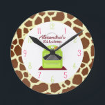 Horloge Ronde Giraffe Print Kitchen Clock<br><div class="desc">A clock featuration of a green stove at center.  Background est giraffe print pattern. Numerals are pink and green.  Personalize with your name.</div>