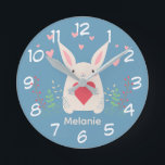 Horloge Ronde Joli Lapin Blanc Avec Coeur Personnalisé<br><div class="desc">Adorable lapin blanc tenant un coeur rouge avec des fleurs de printemps et des coeurs roses au-dessus.</div>
