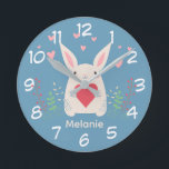Horloge Ronde Joli Lapin Blanc Avec Coeur Personnalisé<br><div class="desc">Adorable lapin blanc tenant un coeur rouge avec des fleurs de printemps et des coeurs roses au-dessus.</div>