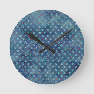 Horloge Ronde Les flocons de neige de Noël sur un arrière - plan