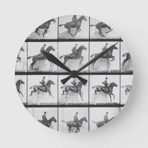 Horloge Ronde L'homme et le cheval sautant une barrière,
