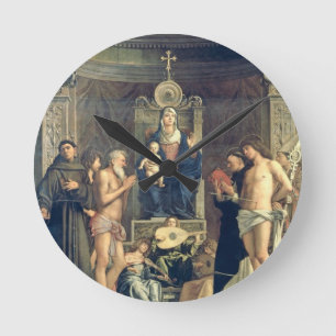 Horloge Ronde Madonna et enfant couronnés entre les solides
