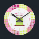 Horloge Ronde Madras<br><div class="desc">A clock featuring à illustration of a green stove at center.  Background est madras inspecred plaid patauger. Numerals are pink and green.  Personalize with your name.</div>