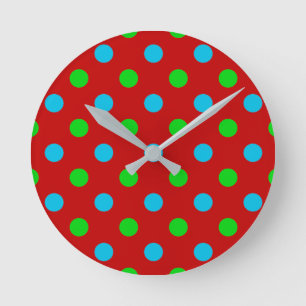 Horloge Ronde Motif à pois bleus et verts sur fond rouge
