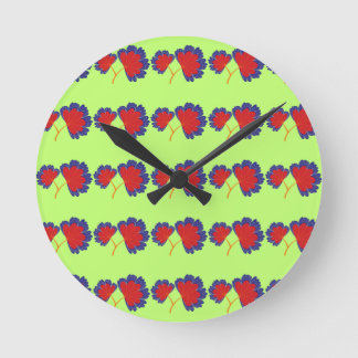 Horloge Ronde Motif de fleurs colorées sur Arrière - plan vert