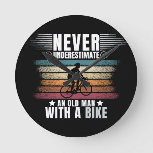 Horloge Ronde Ne sous-estimez jamais un vieil homme à vélo