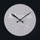 Horloge Ronde Nom de famille moderne personnalisé<br><div class="desc">Il s'agit d'un design de nom de famille élégant, moderne, gris, personnalisé. Il est en gris tendance avec typographie stylée. Ce design chic est idéal comme cadeau personnalisé ou parfait comme un nouvel ajout à votre décor maison. Pour personnaliser, ajoutez simplement votre nom dans la zone de texte personnalisée. Pour...</div>