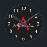 Horloge Ronde Nom du monogramme rouge noir de la fille<br><div class="desc">Horloge de nom de monogramme simple en rouge et noir. Cela rend le cadeau parfait pour 16 ans,  mariage,  douche nuptiale,  anniversaire,  baby shower ou bachelorette pour quelqu'un qui aime le luxe glam et les styles chic.</div>