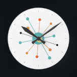 Horloge Ronde Orange Turquoise L'Âge Atomique Commencé Mi-Siècle<br><div class="desc">Cette horloge moderne colorée du milieu du siècle présente une étoile atomique en bleu turquoise,  deux nuances d'orange et de jaune,  avec des lignes noires pour l'heure. Si amusant à ajouter à votre mur !</div>