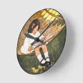 Horloge Ronde Petite fille lire dans un hamac (Angle)
