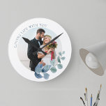 Horloge Ronde Photo Wedding Eucalyptus Leaves Botanical Frame<br><div class="desc">Photo clock with custom text which you can personalize for anyone or any occasion. The photo template is set up for you to add your picture, which is displayed in round shape. This elegant and simple design has a botanical photo frame with dusty blue and green watercolor eucalyptus leaves. If...</div>