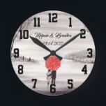 Horloge Ronde Red umbrella Love couple rustic romantic Wedding<br><div class="desc">Red umbrella watercolour painting. Les deux. Beautifully hand painted artwork by myself. Parfait pour Newlyweds. Le venin de Wedding anniversary. Valentine's Day present. You can customize it with your names and date.</div>