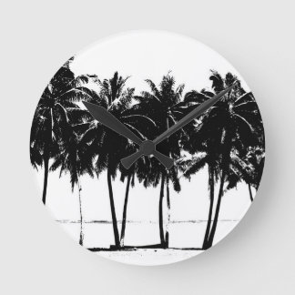 Horloge Ronde Silhouette de palmiers blancs noirs