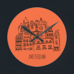 Horloge Ronde Souvenir orange d'Amsterdam Netherlands<br><div class="desc">Amsterdam is the capital and most populous municipality of the Kingdom of the Netherlands. Les meilleurs souvenirs sont toxiques. Holland attracks a lot of tourts every year. Have you not visited the beautiful city Amsterdam yet. Parfait pour Amsterdam,  Hollande.</div>