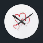 HORLOGE RONDE **TRIPLER LES COEURS** FERMER<br><div class="desc">CETTE HORLOGE EST UNE GRANDE "IDÉE DE CADEAU" POUR TOUS LES PERSONNES ET LES TEMPS AMOUREUX DANS VOTRE VIE...  OU POUR "VOUS" AUSSI!</div>