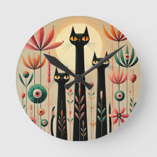 Horloge Ronde Trois chats noirs au milieu d'un design floral vib