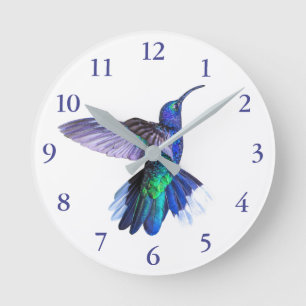 Horloge Ronde Un colibri mauve dans un beau pot