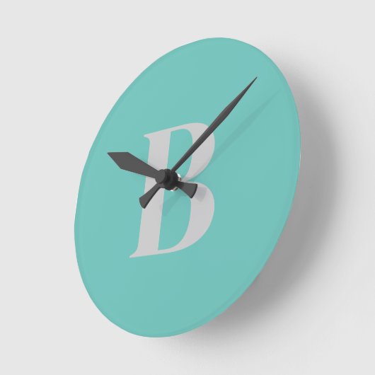 Horloge Ronde Unique Unique Lumière Turquoise Gris Initiale (Angle)
