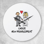 Horloge Ronde Wedding Cartoon<br><div class="desc">A cute cartoon of a newlywed couple captioned under new management. C'est la bride ou le groom that the trousers in the marriage ? Great for a wedding venin.</div>
