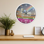 Horloge Unicorn Foal et mère Rainbow Personnalisé<br><div class="desc">This design created though digital art. It may be personalized in the area provide or customizing by choosing the click to customize further option and changing the name, initials or words. Donc, change le texte color and style or delete the text for an image only design. Contact me at colorflowcreations@gmail.com...</div>