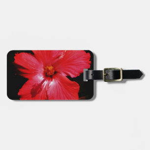 Hot-roze rode hibiscus-bloem op zwart bagagelabel