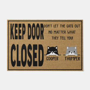 Houd de deur dicht, laat de katten niet uit de deu deurmat