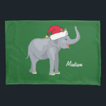 Housse D'oreillers Christmas Elephant<br><div class="desc">Ce magnifique oreiller d'éléphant de Noël présente un bel éléphant souriant portant un chapeau de Père Noël rouge avec un tronc surélevé. Cette jolie literie personnalisée est décorée d'un charmant arrière - plan de vacances vert. Personnalisez avec votre propre texte en bas pour un cadeau élégant.</div>