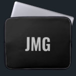 Housse Pour Ordinateur Portable Écran monogramme sur mesure pour ordinateur portab<br><div class="desc">Vous pouvez personnaliser le monogramme argenté qui est au centre de cette manche noire pour ordinateur portable.</div>