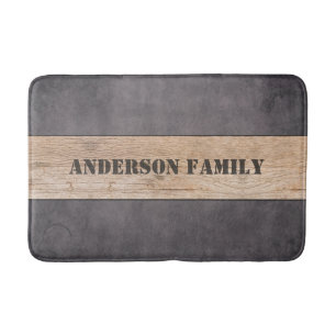 Hout op donkere achtergrond, familienaam badmat