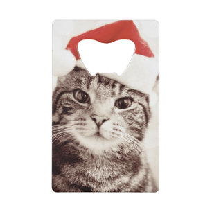 Huishoudelijke tabletkat met rood kerstpet kredietkaart flessenopener