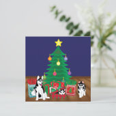 Huskies spelen onder de kerstboom Kaart (Staand voorkant)