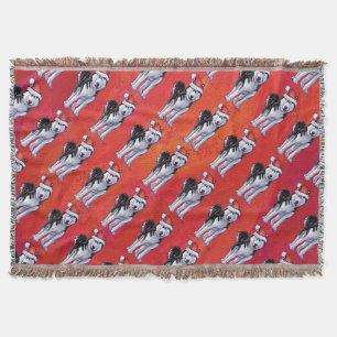 Husky in Santa Hat op Red Deken