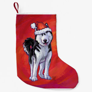 Husky in Santa Hat op Red Kleine Kerstsok