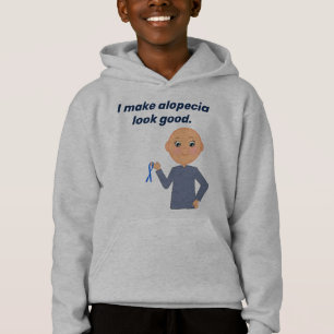 "I Make Alopecia Look Good" avec un petit caricatu