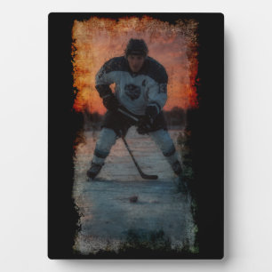 IJshockeyspeler bij zonsondergang Fotoplaat