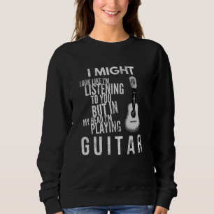 Ik zou kunnen kijken of ik naar je gitaar luister. trui