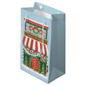 Illustratieve kerstdagen in de kerstwinkel van de  klein cadeauzakje (Voorkant Gekanteld)