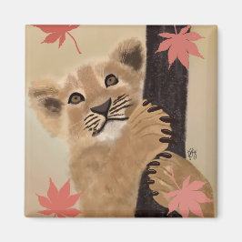 Ímã filhote de leão brincando magneet