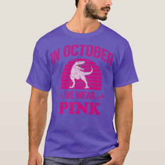 In oktober Draag we roze dinosauriërs met een bors T-shirt