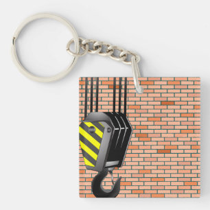 Industriële kraanhaak met bakstenen muur sleutelhanger