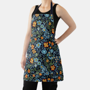 Ingewikkelde bloemkunst: blauwe en oranje bloemen schort