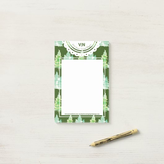 Initiaal met kersthand met waterkleurige bomen post-it® notes (Op bureau)