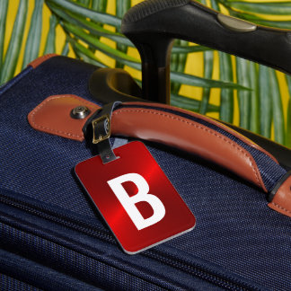 Initiaal met rood geborsteld metallisch monogram bagagelabel